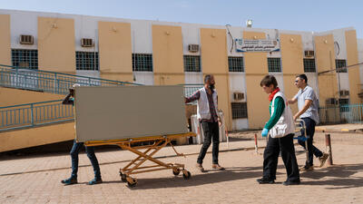 MSF staff and volunteers trying to work with what is available to get the hospital operational.