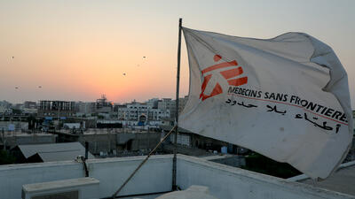 MSF flag over the top of the hospital