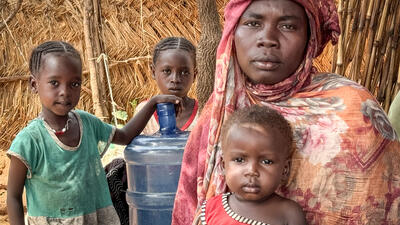 Portrait of Aziza Idriss and three of her children.