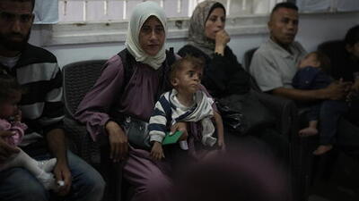 A Palestinian mother identified as Donia Alouf, 33 years old and her son 1 year old Ahmed, who was diagnosed with malnutrition