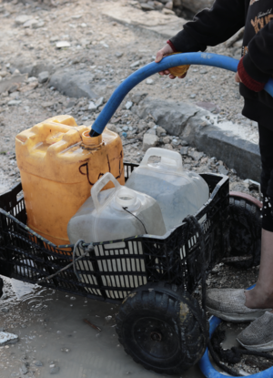 kid filling water jug
