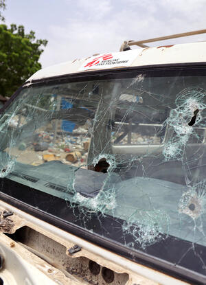 truck with bullet marks on the windshield