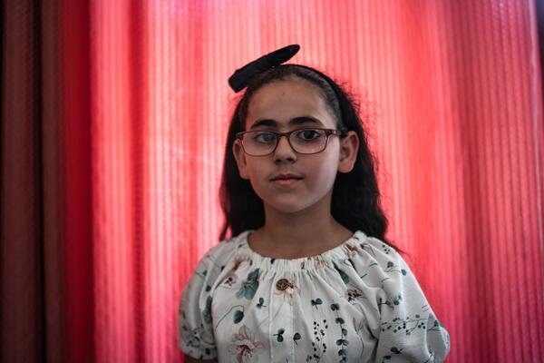 Yasser Abu Markhiyeh's daughter stands in her room in Hebron on 2 May 2023