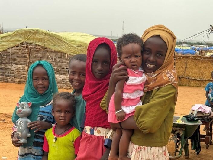 From left to right: Mahali (proudly holding Tom), Mulhim, Muhamat, Mihaf, Mihan, and Mushatha