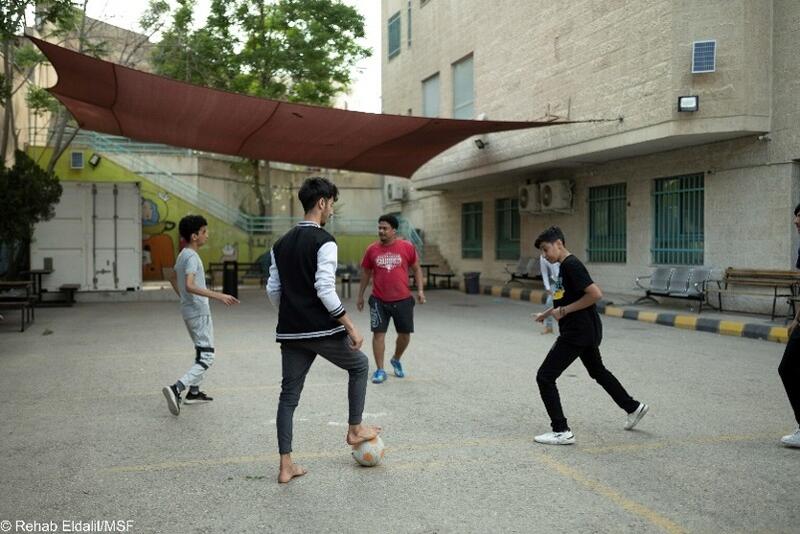 Patients enjoying one of the weekly soccer matches in the hospital garden, organized by the mental health team. Reconstructive Surgery Hospital, Amman, Jordan, 2024.