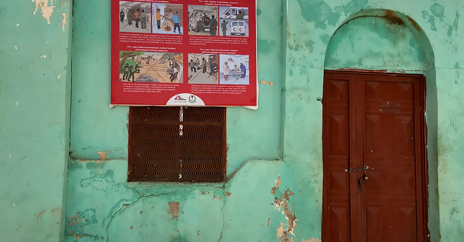 Awareness messages promoting safety and protection for patients and staff on the entrance of El Geneina Teaching Hospital, MSF-supported hospital in West Darfur.