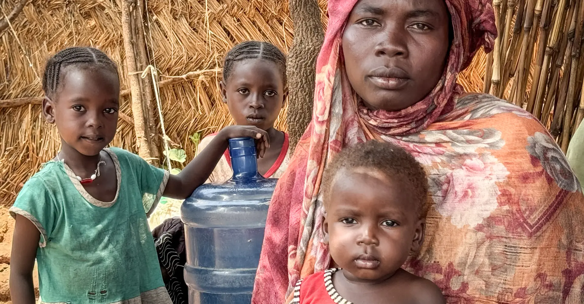 Portrait of Aziza Idriss and three of her children.