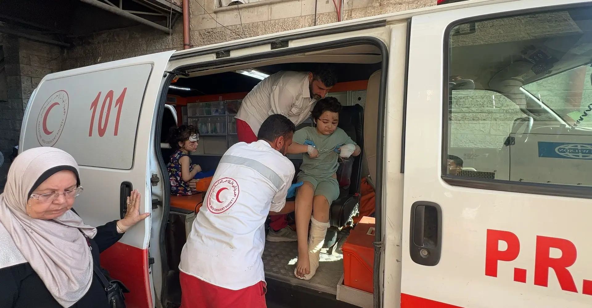 8-year-old Kareem and his 4-year-old sister Julia are being evacuated with their family from Gaza City to Al Aqsa Hospital in the southern Gaza Strip due to the lack of medical supplies.
