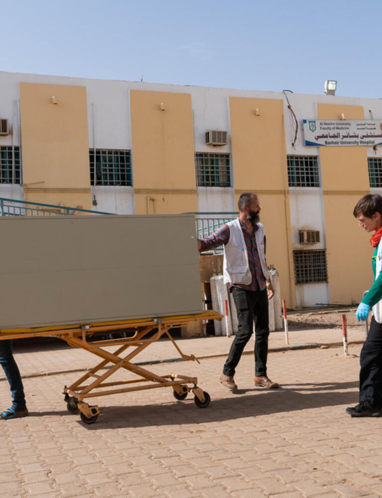 MSF staff and volunteers trying to work with what is available to get the hospital operational.