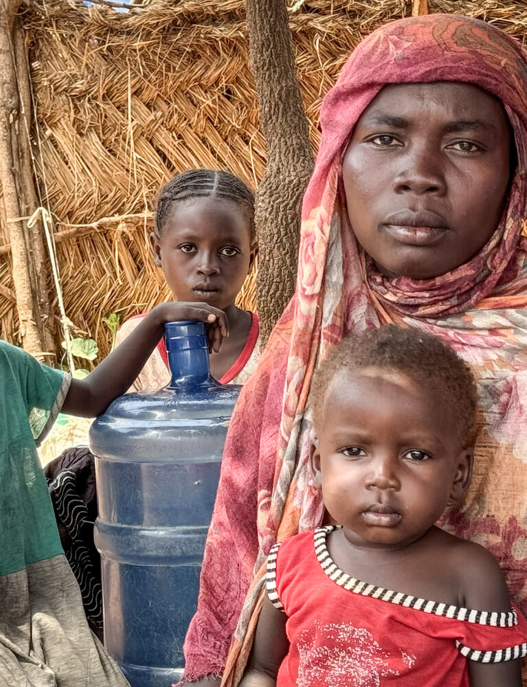 Portrait of Aziza Idriss and three of her children.